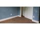 Empty bedroom with blue walls and brown carpet at 2159 Martin Luther King, Jr. Dr, Atlanta, GA 30310