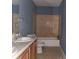 Bathroom with double vanity and bathtub at 2159 Martin Luther King, Jr. Dr, Atlanta, GA 30310