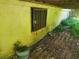 Basement exterior with a window and surrounding greenery at 2159 Martin Luther King, Jr. Dr, Atlanta, GA 30310
