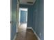 Hallway with carpeted floor and blue walls at 2159 Martin Luther King, Jr. Dr, Atlanta, GA 30310