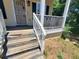 Old wooden steps leading to a porch with security door at 2159 Martin Luther King, Jr. Dr, Atlanta, GA 30310