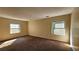 Large bedroom with two windows and neutral walls at 3010 Parc Lorraine, Lithonia, GA 30038