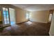 Spacious living room with patio access and ample natural light at 3010 Parc Lorraine, Lithonia, GA 30038