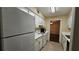 Galley-style kitchen featuring white cabinets and built-in appliances at 3010 Parc Lorraine, Lithonia, GA 30038