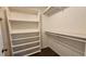 Walk-in closet with shelves and hanging rods at 3010 Parc Lorraine, Lithonia, GA 30038
