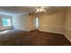 Living room with carpet, large window, and ceiling fan at 3010 Parc Lorraine, Lithonia, GA 30038