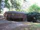 Brick house with wooden deck and backyard at 1142 Hembree Ln, Austell, GA 30168