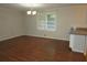 Bright dining room features hardwood floors and a chandelier at 1142 Hembree Ln, Austell, GA 30168