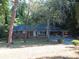 Brick ranch house with carport and mature trees at 1142 Hembree Ln, Austell, GA 30168