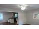 Open living room with hardwood floors and a view of the kitchen at 1142 Hembree Ln, Austell, GA 30168