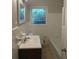 Clean bathroom with white tile and a bathtub at 1142 Hembree Ln, Austell, GA 30168