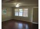 Living room with hardwood floors and large windows at 1142 Hembree Ln, Austell, GA 30168