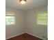 Simple bedroom with two windows and wood flooring at 1142 Hembree Ln, Austell, GA 30168