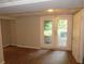 Finished basement features LVP flooring, updated doors and access to the backyard at 1142 Hembree Ln, Austell, GA 30168