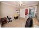 Bright bedroom with window, closet, and workspace at 377 Mill Ridge Way, Lawrenceville, GA 30046