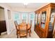 Bright dining room with bay window and wooden furniture at 377 Mill Ridge Way, Lawrenceville, GA 30046