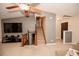 Living room with stairs and a large TV at 377 Mill Ridge Way, Lawrenceville, GA 30046