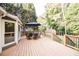 Deck with table and chairs overlooking wooded area at 377 Mill Ridge Way, Lawrenceville, GA 30046
