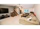 Spacious living room featuring a large sectional sofa and a flat-screen TV at 377 Mill Ridge Way, Lawrenceville, GA 30046