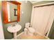 Basement bathroom with pedestal sink and shower at 377 Mill Ridge Way, Lawrenceville, GA 30046