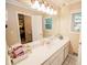 Bright bathroom with vanity, sink, and shower at 377 Mill Ridge Way, Lawrenceville, GA 30046
