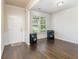 Bright entryway with hardwood floors, featuring a coat closet and a view to the living room at 2248 Annes Lake Cir, Lithonia, GA 30058