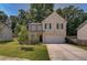 Two-story brick home with a front porch and driveway at 2248 Annes Lake Cir, Lithonia, GA 30058