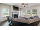 Gathering room with a fireplace, built-in shelving, and hardwood floors at 2248 Annes Lake Cir, Lithonia, GA 30058