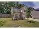 Two-story brick home with a front porch and yard at 2248 Annes Lake Cir, Lithonia, GA 30058