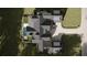 Luxury home aerial view showcasing the house and surrounding landscape at 841 Woodvale Pt, Suwanee, GA 30024