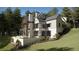 Luxury home with a stone retaining wall and a large backyard at 841 Woodvale Pt, Suwanee, GA 30024