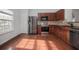 Kitchen with hardwood floors and stainless steel appliances at 2100 Meadow Peak Rd, Duluth, GA 30097