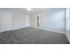 Well-lit bedroom with carpet and en-suite bathroom access at 2100 Meadow Peak Rd, Duluth, GA 30097