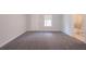 Simple bedroom with carpeted floor and exterior access at 2100 Meadow Peak Rd, Duluth, GA 30097