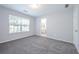 Bright bedroom with gray carpeting and en-suite bathroom at 2100 Meadow Peak Rd, Duluth, GA 30097