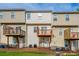 Back exterior of townhome with private decks and yard at 2100 Meadow Peak Rd, Duluth, GA 30097