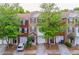 Exterior view of townhomes with brick fronts and attached garages at 2100 Meadow Peak Rd, Duluth, GA 30097