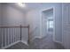 Upper hallway with staircase and access to bedrooms at 2100 Meadow Peak Rd, Duluth, GA 30097