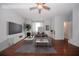 Spacious living room with hardwood floors and large TV at 2100 Meadow Peak Rd, Duluth, GA 30097