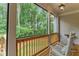 Screened porch with rocking chairs and wooded view at 105 Summerlin Dr, Canton, GA 30115