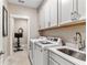 Laundry room with washer, dryer and cabinets at 105 Summerlin Dr, Canton, GA 30115