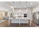 Modern kitchen featuring a large island and stainless steel appliances at 105 Summerlin Dr, Canton, GA 30115