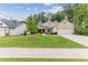 House exterior view showcasing landscaping and driveway at 105 Summerlin Dr, Canton, GA 30115