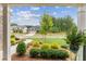 Landscaped front yard with manicured shrubs and trees at 105 Summerlin Dr, Canton, GA 30115