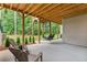 Relaxing patio with seating area, swing, and view of backyard at 105 Summerlin Dr, Canton, GA 30115