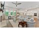 Open concept living room with kitchen views and hardwood floors at 105 Summerlin Dr, Canton, GA 30115