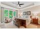 Spacious main bedroom with wooded views and sitting area at 105 Summerlin Dr, Canton, GA 30115