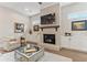 Bright living room features a fireplace, built-ins, and hardwood floors at 105 Summerlin Dr, Canton, GA 30115