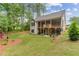 House with a large backyard, deck, and screened porch at 105 Summerlin Dr, Canton, GA 30115