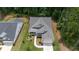 Aerial view of a house with a landscaped yard at 105 Summerlin Dr, Canton, GA 30115
